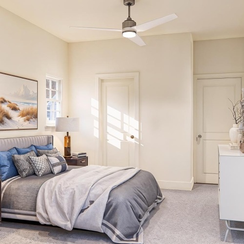 a bedroom with a bed and two nightstands