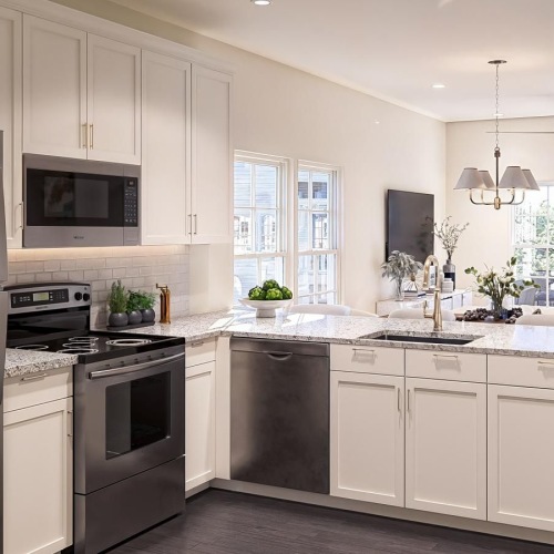 a kitchen with white cabinets